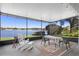 Relaxing screened porch overlooking a peaceful lake view at 524 Quail Hill Dr, Debary, FL 32713