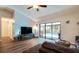 Spacious living room with a view of the pool and sliding glass doors at 5401 Lighthouse Rd, Orlando, FL 32808