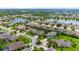 Aerial view of a luxury community with lakes, lush landscaping, and upscale homes at 5423 Swordfern Ct, Port Orange, FL 32128