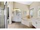 Bathroom features double vanity, soaking tub and shower at 5423 Swordfern Ct, Port Orange, FL 32128