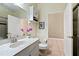 Clean bathroom with single sink vanity and toilet at 5423 Swordfern Ct, Port Orange, FL 32128