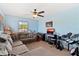 Bedroom with sectional sofa, musical instruments and tv at 5423 Swordfern Ct, Port Orange, FL 32128