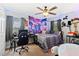 Bedroom with desk, bed and space themed decor at 5423 Swordfern Ct, Port Orange, FL 32128