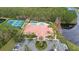 Resort-style community pool with tennis and pickleball courts at 5423 Swordfern Ct, Port Orange, FL 32128
