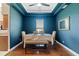Charming dining room with dark blue walls and a wooden bench at 5423 Swordfern Ct, Port Orange, FL 32128