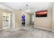 Hallway with carpet, access to bathroom and bedrooms at 5423 Swordfern Ct, Port Orange, FL 32128
