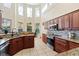 Well-equipped kitchen with granite counters and an island at 5423 Swordfern Ct, Port Orange, FL 32128