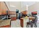 Large kitchen with granite counters, stainless steel appliances, and an island at 5423 Swordfern Ct, Port Orange, FL 32128