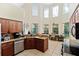 Spacious kitchen with granite countertops and an island at 5423 Swordfern Ct, Port Orange, FL 32128