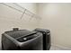 Laundry room with washer and dryer, and overhead shelving at 5423 Swordfern Ct, Port Orange, FL 32128
