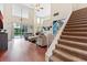 Spacious living room with high ceilings, hardwood floors, and access to backyard at 5423 Swordfern Ct, Port Orange, FL 32128