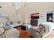 Bright living room featuring hardwood floors and ample seating at 5423 Swordfern Ct, Port Orange, FL 32128