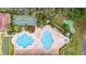 Aerial view of community pool, spa, shuffleboard, and putting green at 5423 Swordfern Ct, Port Orange, FL 32128