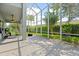 Spacious screened-in patio, perfect for relaxing and outdoor dining at 5423 Swordfern Ct, Port Orange, FL 32128