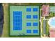 Aerial view of tennis, basketball, and pickleball courts at 5423 Swordfern Ct, Port Orange, FL 32128