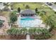 Aerial view of community pool with pergola and surrounding landscaping at 5989 Painted Leaf Dr, Winter Garden, FL 34787