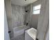 Updated bathroom with tiled shower and bathtub at 610 Division St, Daytona Beach, FL 32114