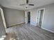 Bright bedroom with wood-look floors and ceiling fan at 610 Division St, Daytona Beach, FL 32114