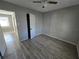 Simple bedroom with gray walls, wood-look floors and a closet at 610 Division St, Daytona Beach, FL 32114