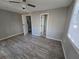 Spacious bedroom featuring wood-look floors and neutral walls at 610 Division St, Daytona Beach, FL 32114