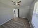 Simple bedroom with gray walls, wood-look floors, and a closet at 610 Division St, Daytona Beach, FL 32114