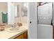 Bathroom with stackable washer and dryer unit at 963 Helmsley Ct # 207, Lake Mary, FL 32746