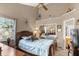 Main bedroom with high ceilings and a large window at 963 Helmsley Ct # 207, Lake Mary, FL 32746