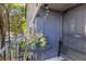 Front entrance with hanging wind chimes and potted plants at 963 Helmsley Ct # 207, Lake Mary, FL 32746