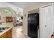 View of kitchen appliances and access to the living room at 963 Helmsley Ct # 207, Lake Mary, FL 32746