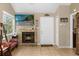 Living room featuring a fireplace and large TV at 963 Helmsley Ct # 207, Lake Mary, FL 32746