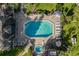 Community pool and spa with plenty of lounge chairs at 963 Helmsley Ct # 207, Lake Mary, FL 32746