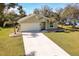One-story home with landscaped yard and driveway at 981 Wilmington Dr, Deltona, FL 32725