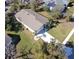Aerial view of a single-story house with a large yard and driveway at 981 Wilmington Dr, Deltona, FL 32725