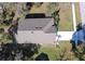 Aerial view of a single-story house with a large yard and driveway at 981 Wilmington Dr, Deltona, FL 32725