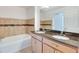 Bathroom boasts double vanity and granite countertop at 981 Wilmington Dr, Deltona, FL 32725