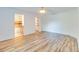 Spacious bedroom with wood-look floors and en-suite bathroom at 981 Wilmington Dr, Deltona, FL 32725