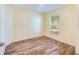 Spacious bedroom with wood-look floors and window at 981 Wilmington Dr, Deltona, FL 32725