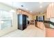 Kitchen with black appliances and granite countertops at 981 Wilmington Dr, Deltona, FL 32725