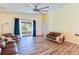 Living room with hardwood floors and sliding glass doors at 981 Wilmington Dr, Deltona, FL 32725