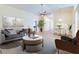 Furnished living room with wood-look floors and large windows at 981 Wilmington Dr, Deltona, FL 32725