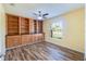 Home office with built-in shelving and hardwood floors at 981 Wilmington Dr, Deltona, FL 32725