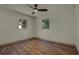 Spacious bedroom with wood-look floors and ceiling fan at 1105 E Ohio Ave, Deland, FL 32724