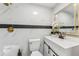 Modern bathroom with white vanity and marble tile at 118 N Sunland Dr, Sanford, FL 32773