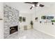 Living room with modern stone fireplace and marble floors at 118 N Sunland Dr, Sanford, FL 32773