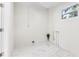 Clean laundry room with white walls and marble floor at 118 N Sunland Dr, Sanford, FL 32773