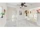 Open living room with marble floors and views to kitchen and backyard at 118 N Sunland Dr, Sanford, FL 32773
