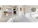 Sunlit living room with marble floors and kitchen view at 118 N Sunland Dr, Sanford, FL 32773