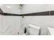 A renovated shower features marble tile and gold fixtures at 118 N Sunland Dr, Sanford, FL 32773