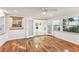 Sunroom with wood floors and French doors leading to the living room at 118 N Sunland Dr, Sanford, FL 32773