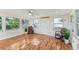 Sunroom with wood floors, rocking chairs, and large windows at 118 N Sunland Dr, Sanford, FL 32773